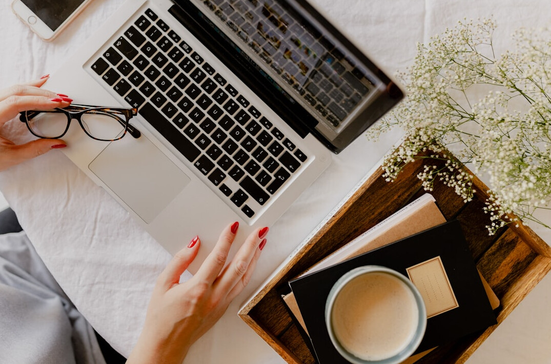 writer typing on laptop