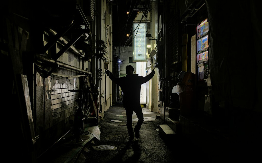 shadowy figure in alley