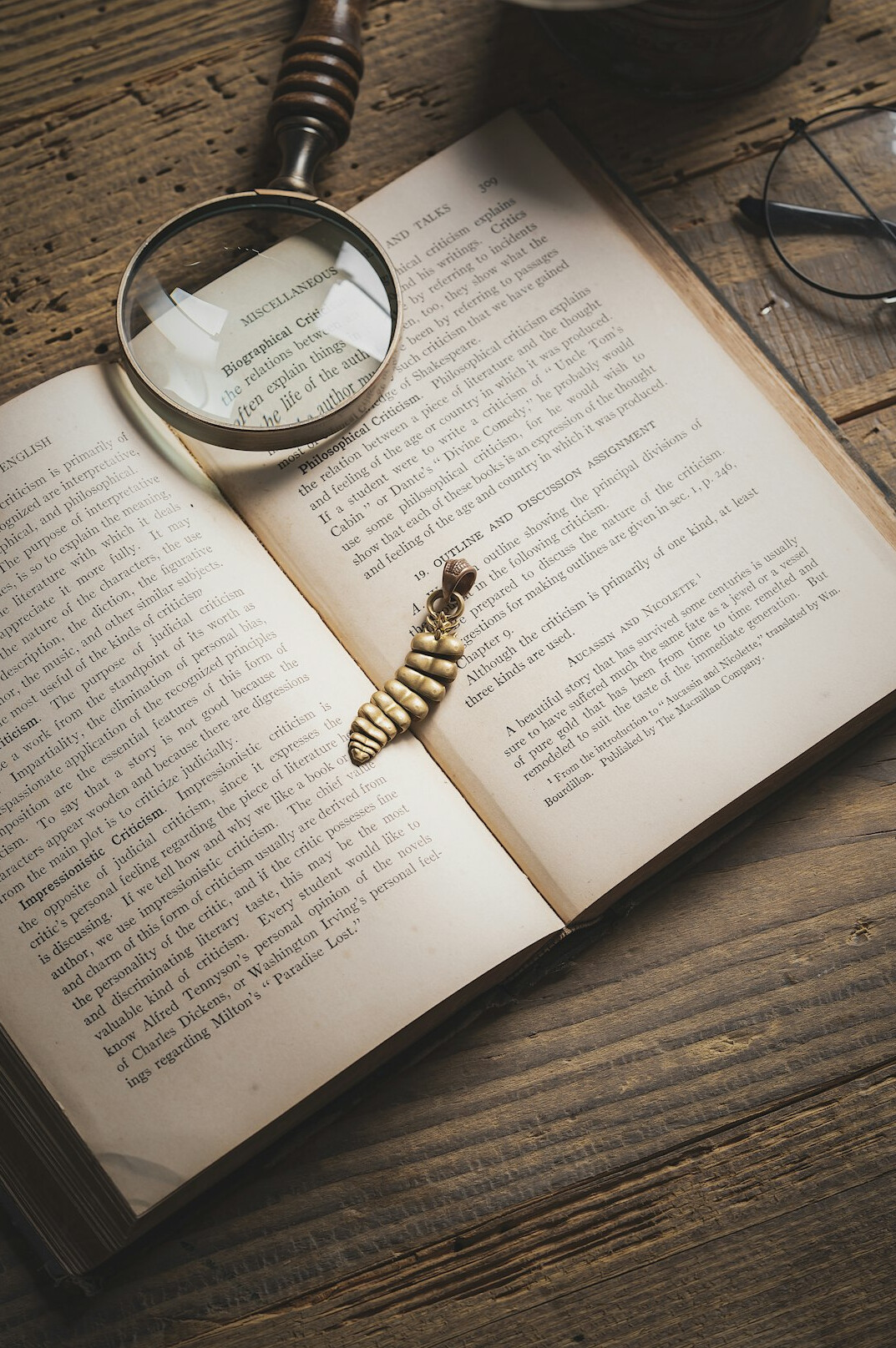 old book with magnifying glass